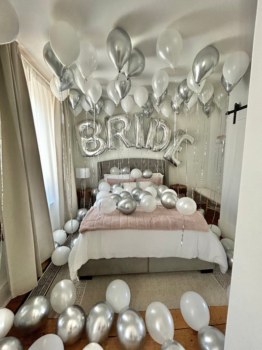 Bride WOW Decor with ceiling balloons, floor balloons, and "BRIDE" letter arch.