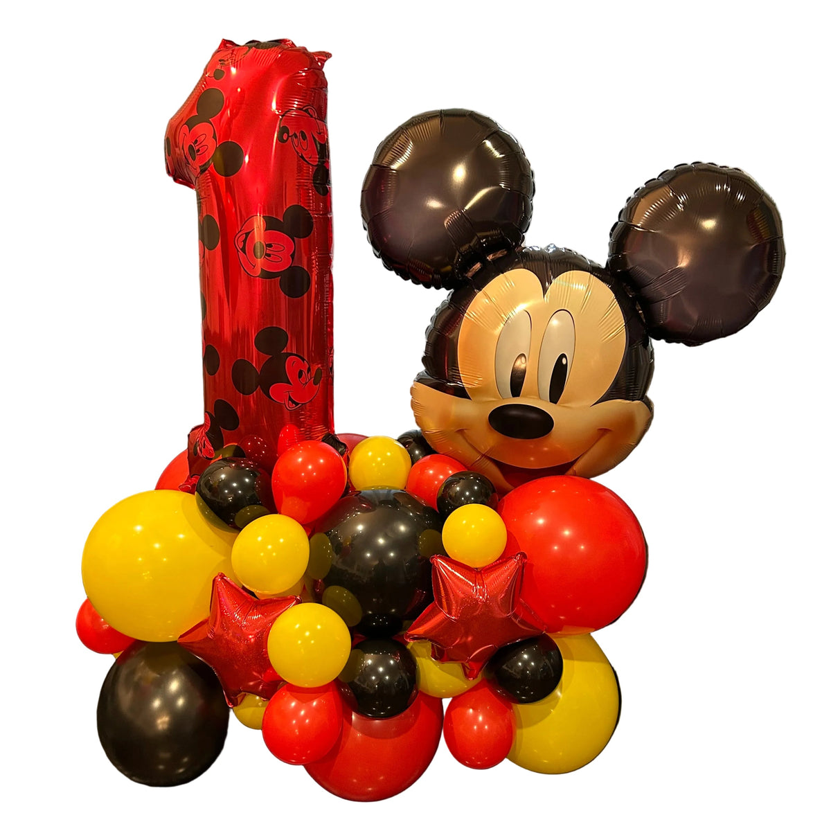 Mickey Mouse first birthday balloon stand with a red number 1 and red, yellow and black balloons