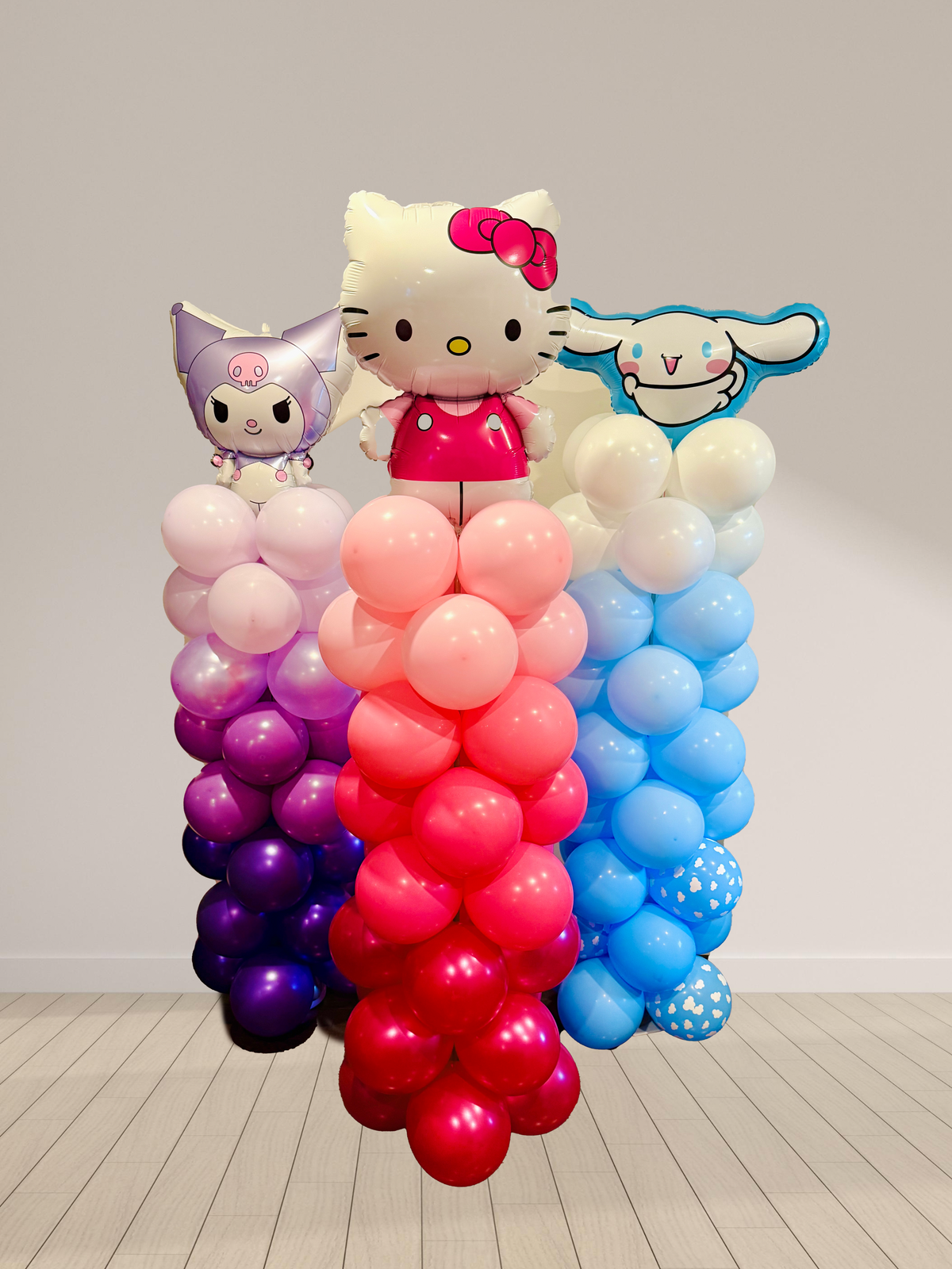 Balloon arch with Hello Kitty and friends on a plain background