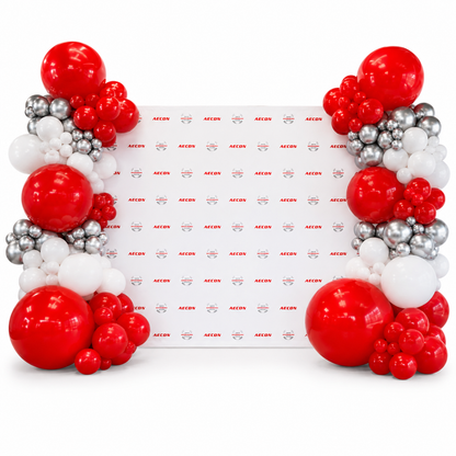 Red, white and silver corporate balloon garlands framing an AECON backdrop