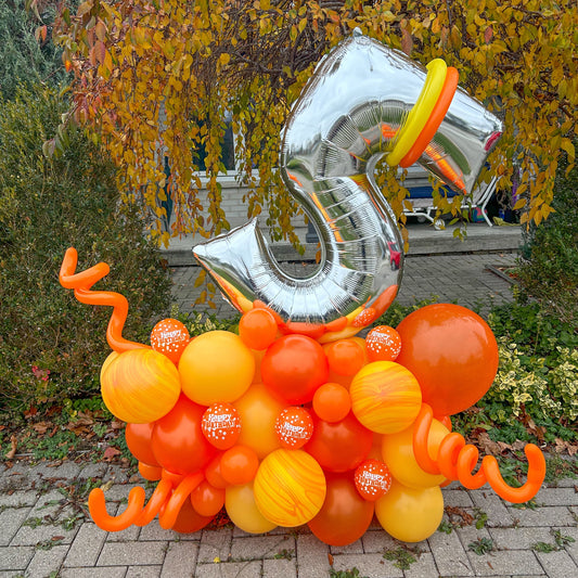 Birthday Number Balloon Arrangement with a silver number balloon and customizable balloon colors for a festive celebration.