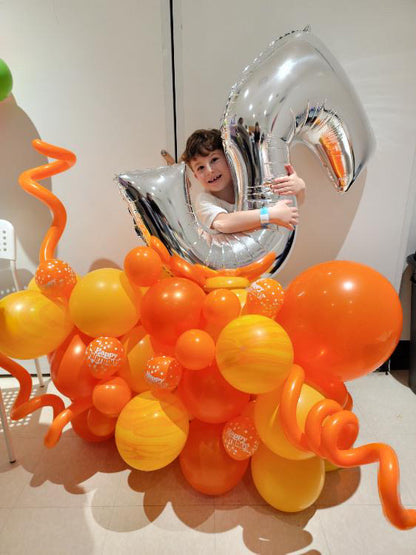 Birthday Number Balloon Arrangement with a silver number balloon and customizable balloon colors for a festive celebration.