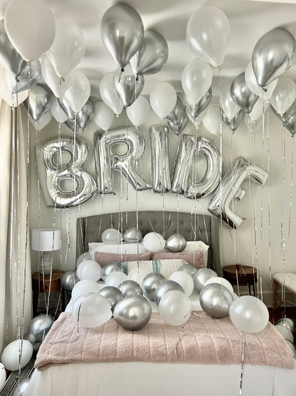 Bride WOW Decor with ceiling balloons, floor balloons, and "BRIDE" letter arch.