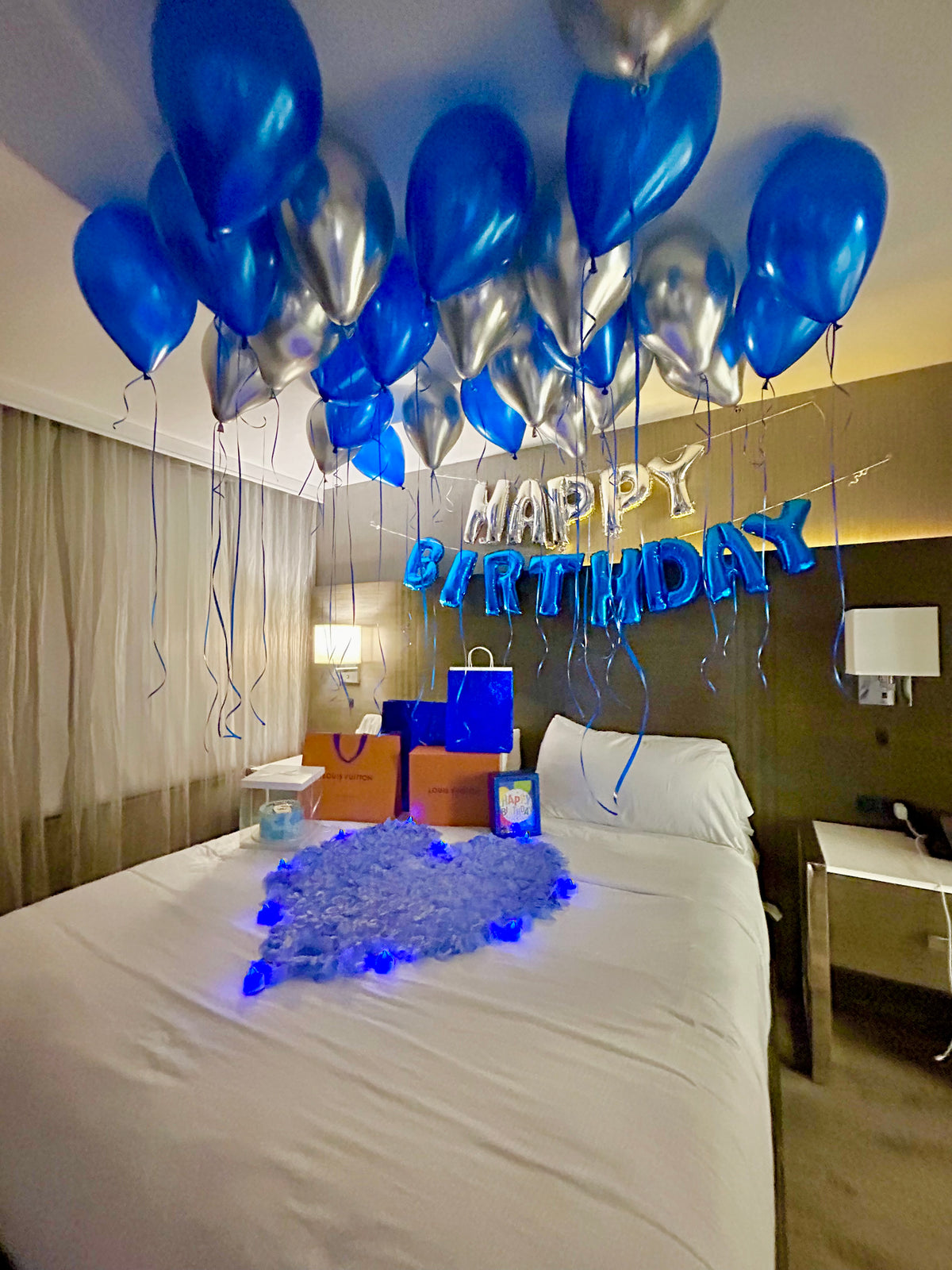Blue & Silver Happy Birthday Balloon Decor with helium balloons, banner, and number stands.