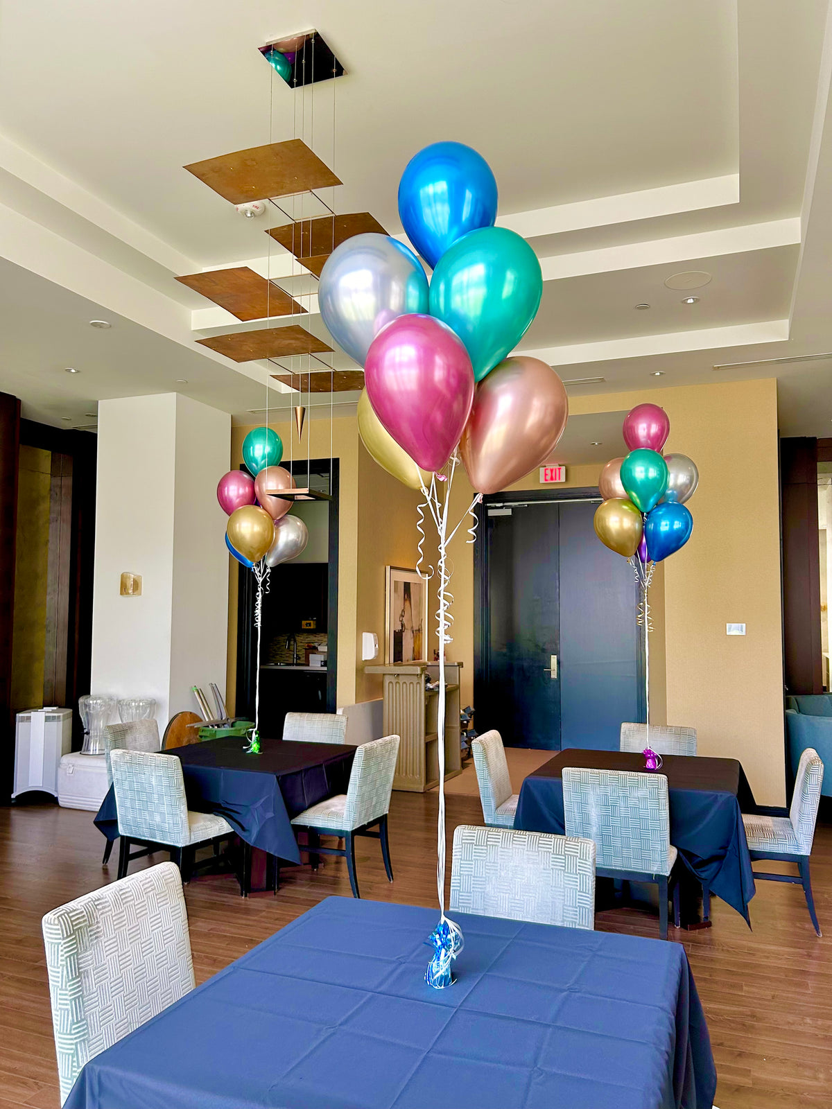 Chrome Balloon Bouquets with helium-filled biodegradable balloons in a bunch of 7, with a balloon weight and bag.