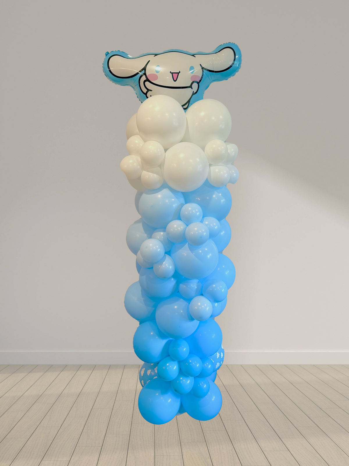 Balloon column with cartoon character head on a plain background