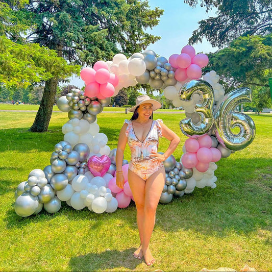 Full Balloon Arch in Toronto featuring a gold metal frame and biodegradable balloons for events.
