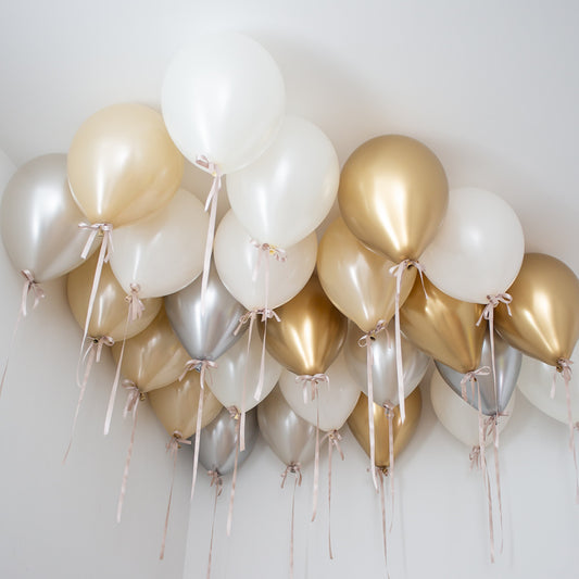 Decorative arrangement of balloons in gold, silver, and white Toronto