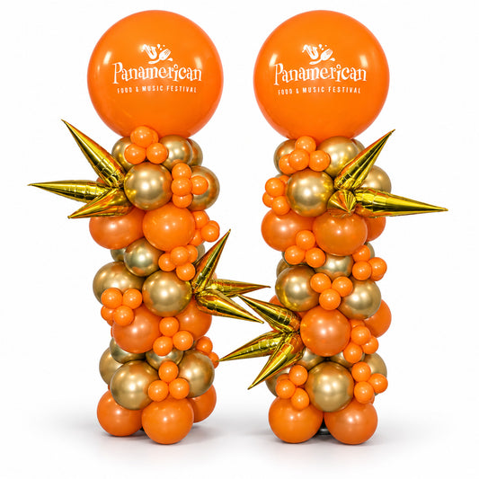Two orange and gold balloon columns with gold starburst accents and Panamerican Food & Music Festival logo toppers by Wooow Balloons in Toronto.