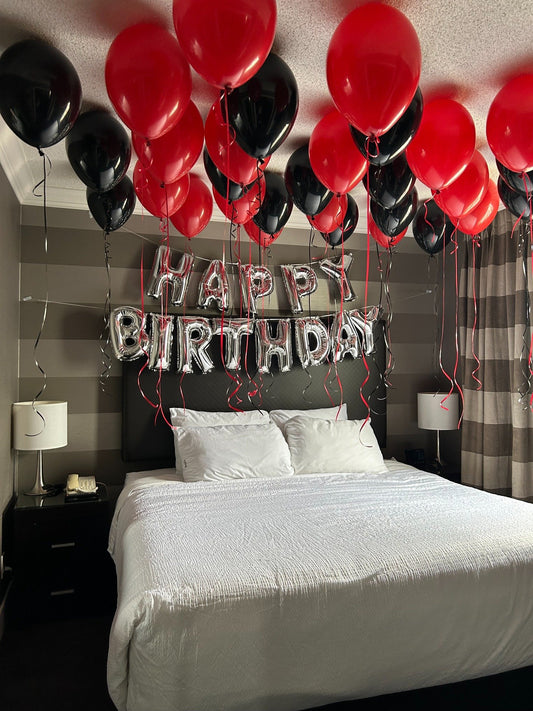 At-home birthday balloon room decoration in red and black colors, Toronto surprise balloon setup by Wooow Balloons