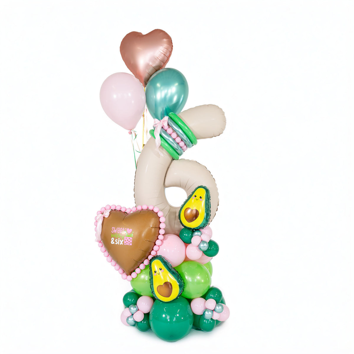 Avocado birthday balloon arrangement by Wooow Balloons in Toronto, featuring a cream number 6, pink and green balloons, hearts and balloon flowers.