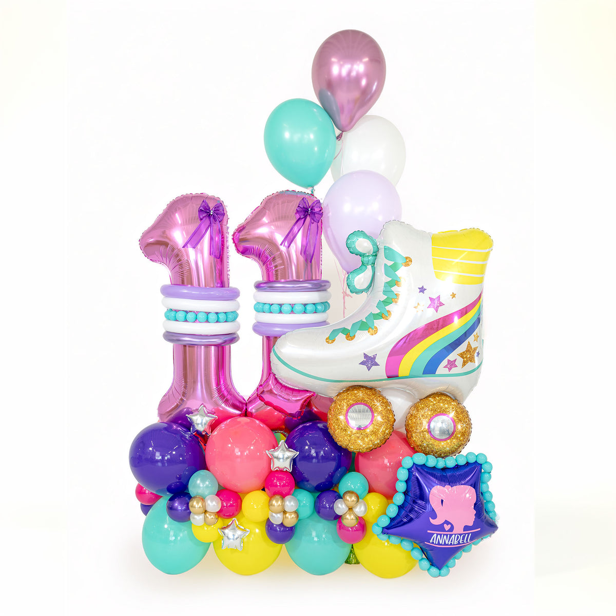 Barbie-inspired birthday balloons by Wooow Balloons in Toronto, with pink number 11 balloons, a rainbow roller skate and a personalised colourful base.