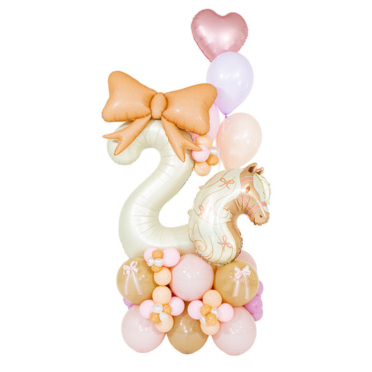 Coquette horse birthday balloon arrangement with a cream number 2, pony foil, peach bow and pastel balloon flowers by Wooow Balloons in Toronto.
