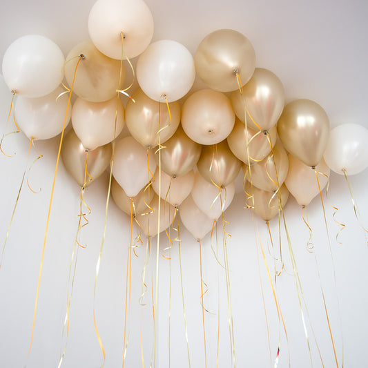 25 creamy helium balloons Toronto ceiling decor with gold ribbon