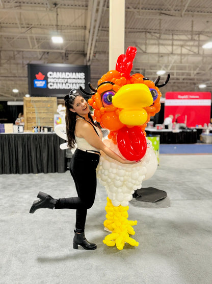 Custom giant chicken balloon sculpture displayed by Wooow Balloons at a corporate event in Toronto