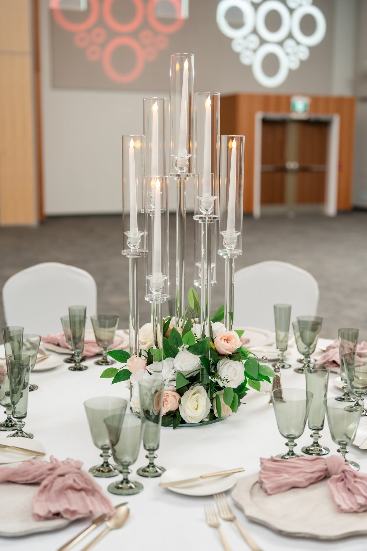 Elegant wedding decor including floral arrangements, centerpieces, and lighting installations by Wooow Balloons.
