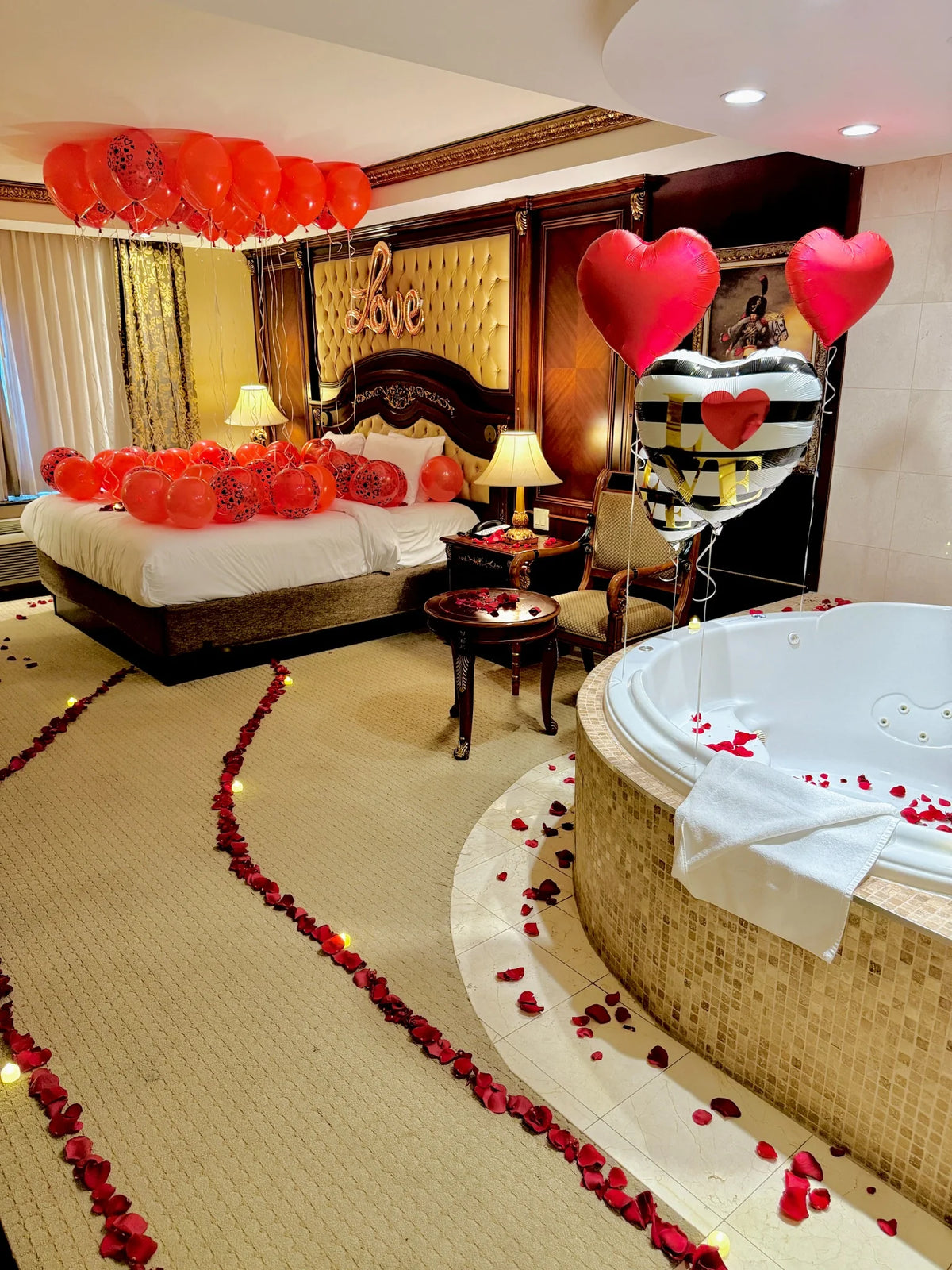 Love balloon setup with roses and lights for romantic celebrations in Toronto.
