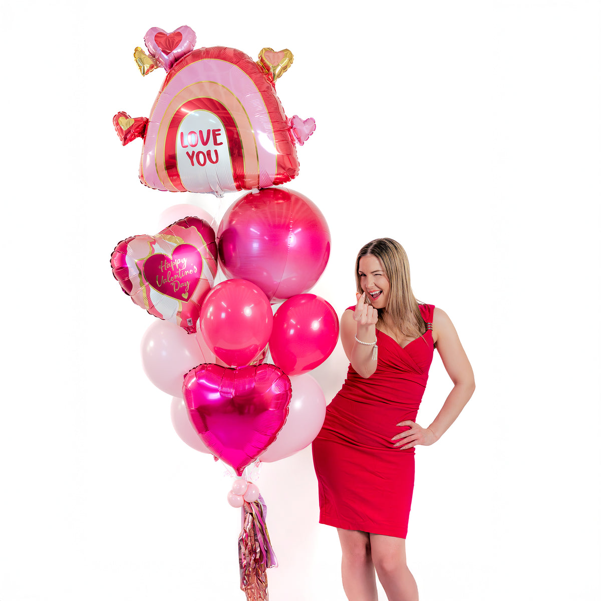 Love You Rainbow Valentine Balloon Bouquet (Toronto) with large rainbow heart foil balloon, heart balloons, latex balloons and tassel weight.