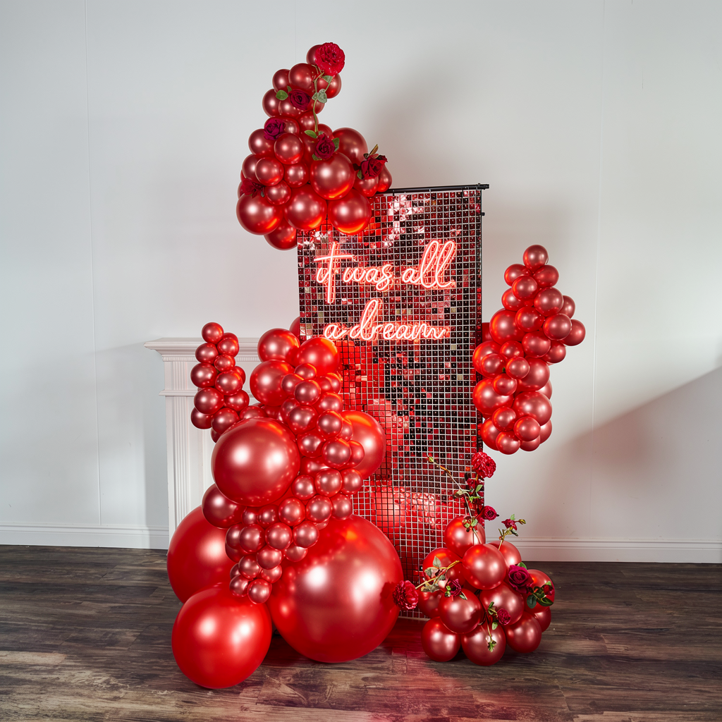 Luxury Valentine’s Day balloons in Toronto featuring a red shimmer wall backdrop and premium balloon installation