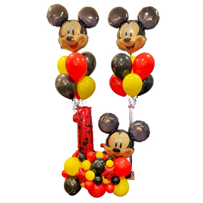 Mickey Mouse first birthday balloon package with two character bouquets and a red number 1 balloon stand