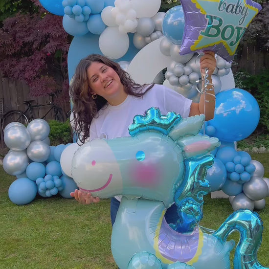 New Baby Born Balloon Decor setup with blue and silver balloons and a rocking horse balloon in Toronto
