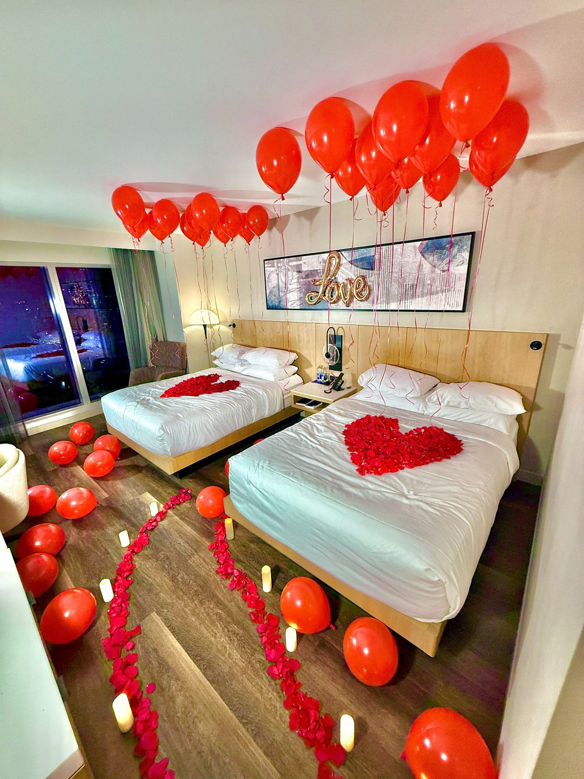 Toronto Hotel Room Decor with real roses, LED candles, and romantic balloon styling for hotel room decoration.