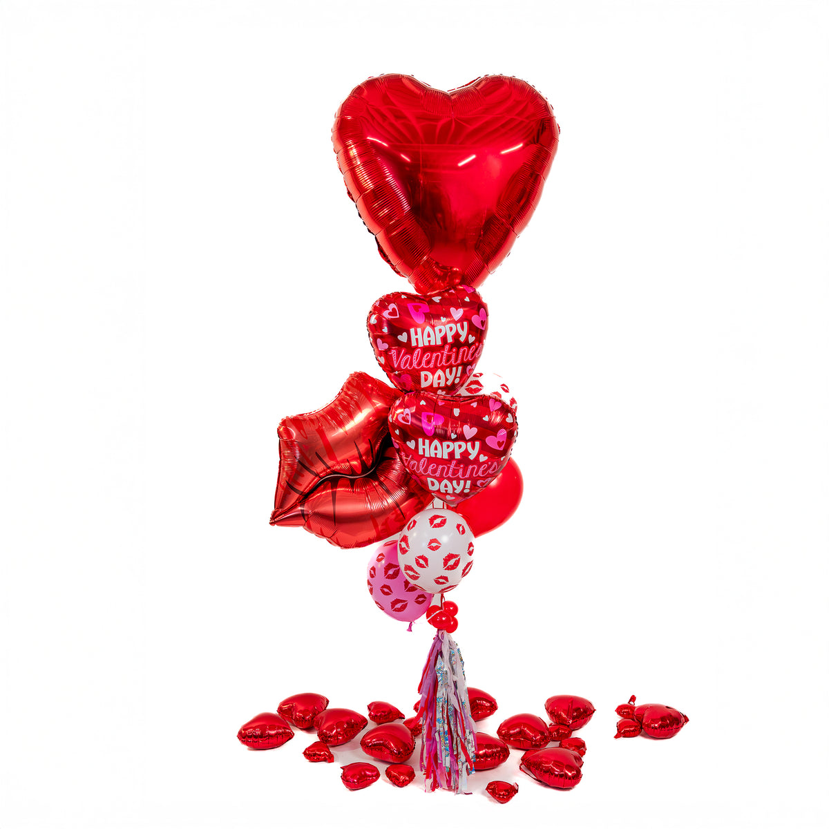 Romantic Valentine balloon bouquet with red heart and kiss-print balloons, styled by Wooow Balloons