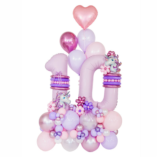 Unicorn birthday balloons by Wooow Balloons in Toronto, with pink and lilac number 10 balloons, unicorn foils, balloon flowers and a pink heart.