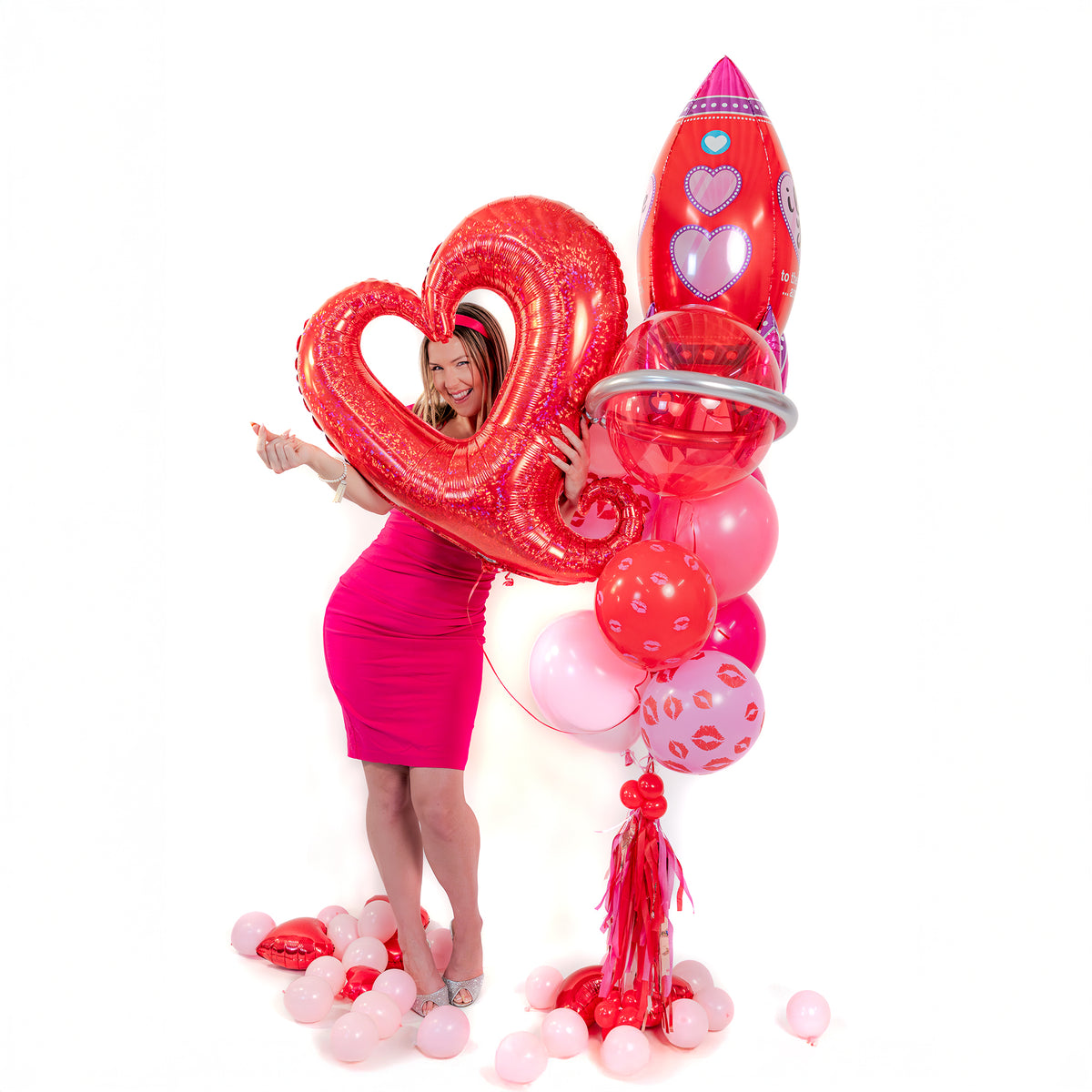 Detail of Valentine balloon bouquet in Toronto with red open-heart foil balloon, rocket foil balloon and romantic pink-red latex balloons.