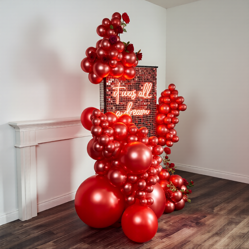 Valentine’s Day balloons Toronto with a red shimmer wall and luxury balloon decor setup.