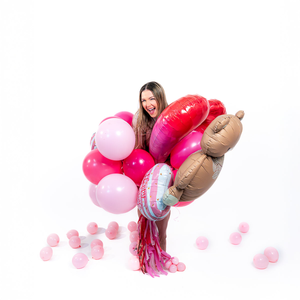 Same day balloon delivery Toronto Valentine bouquet with teddy bear and heart supershape balloons, weight and decorative tassels.
