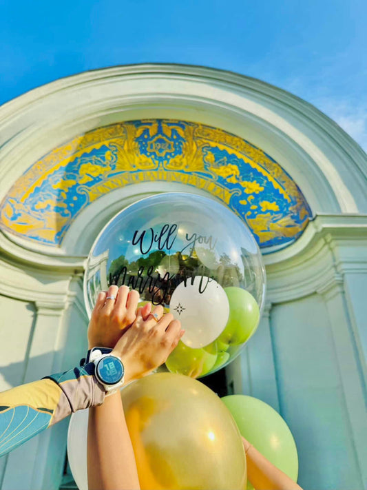 Cute Balloon Bouquet in Toronto with clear bobo balloon, mini balloons inside, heart balloon, and helium balloons—Balloons Toronto gift.